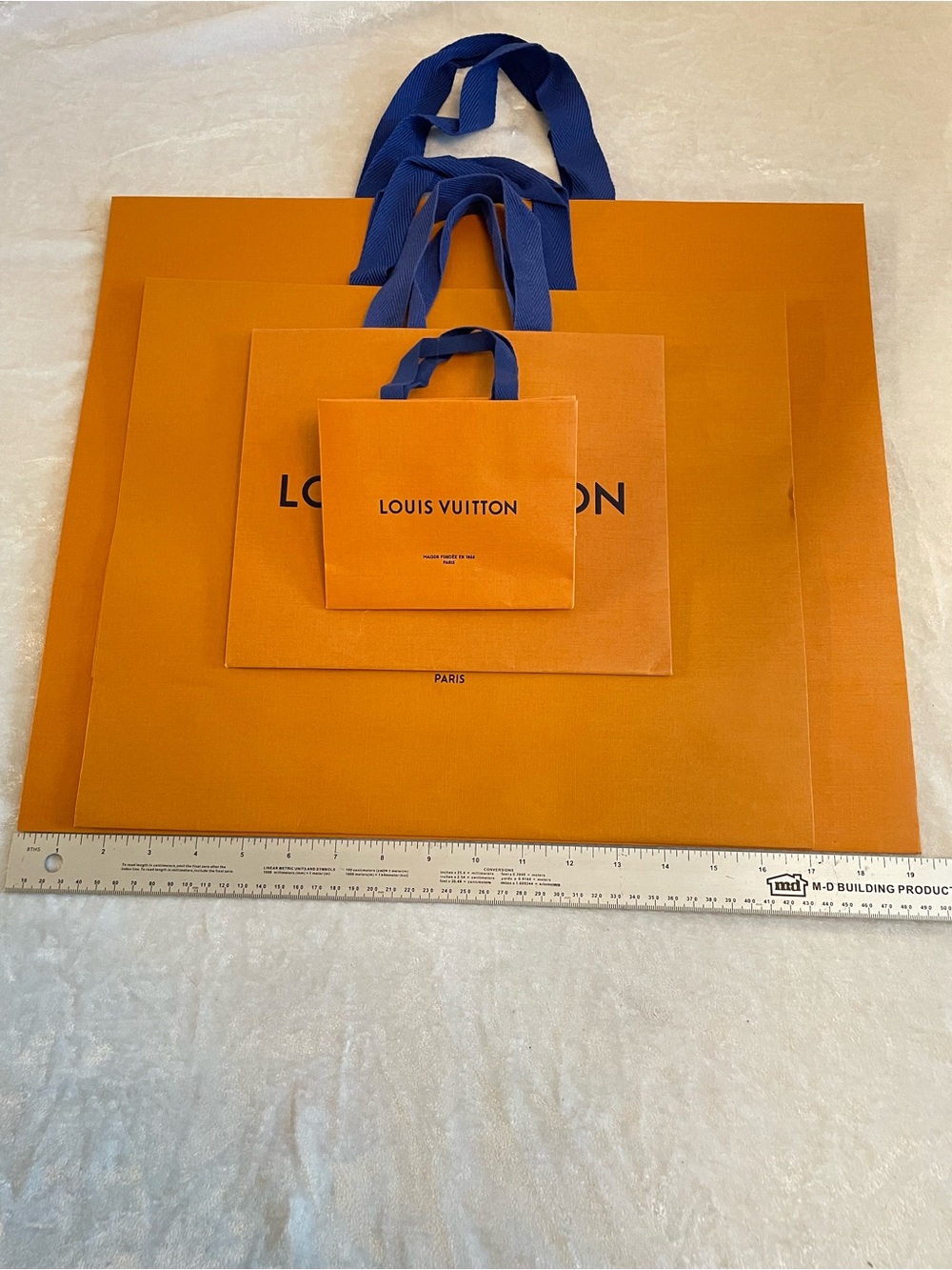 4 Louis Vuitton Orange Shopping Bags with Blue Ribbon Handles